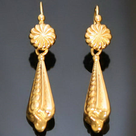 Richly elaborated pendent vintage earrings